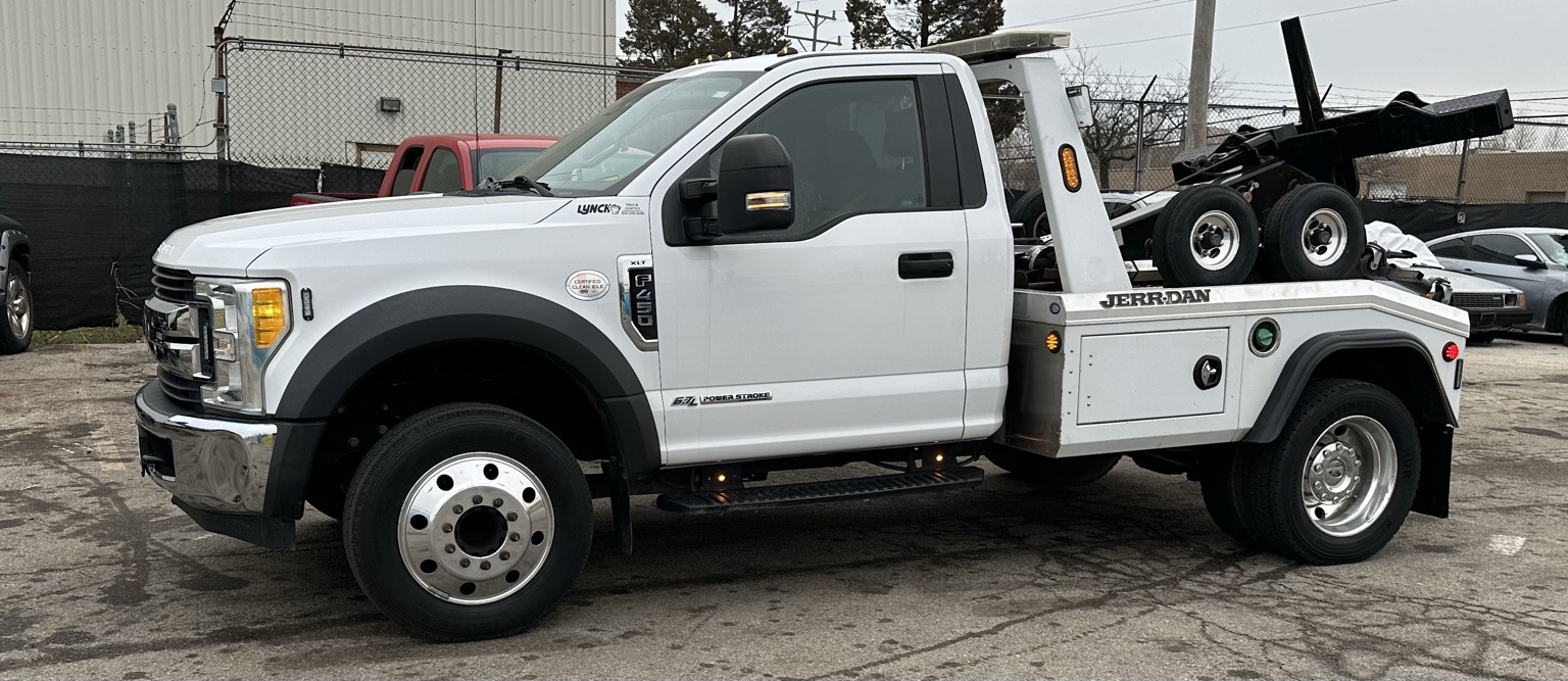 Our actual white Ford F-450 tow truck